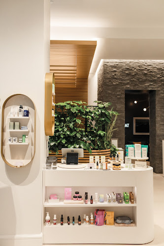 Modern IV therapy lounge at Clean Market with wellness products display.