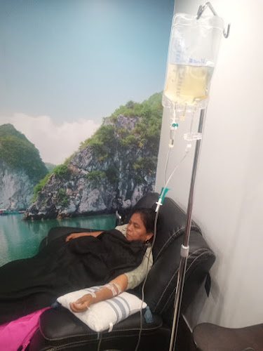 Woman receiving IV therapy at Health Med Spa recliner station