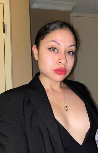 Woman at Jordan Jacobs Medical Artistry in black blazer indoors.