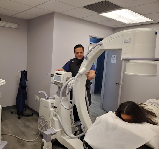 Doctor performing IV therapy procedure at Pain Management NYC clinic